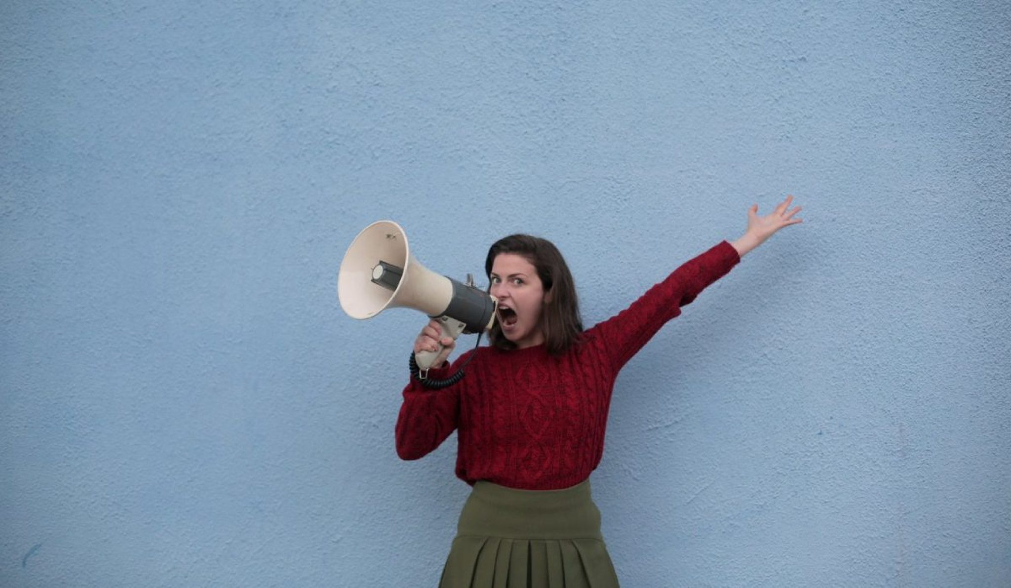 a person yelling into a megaphone